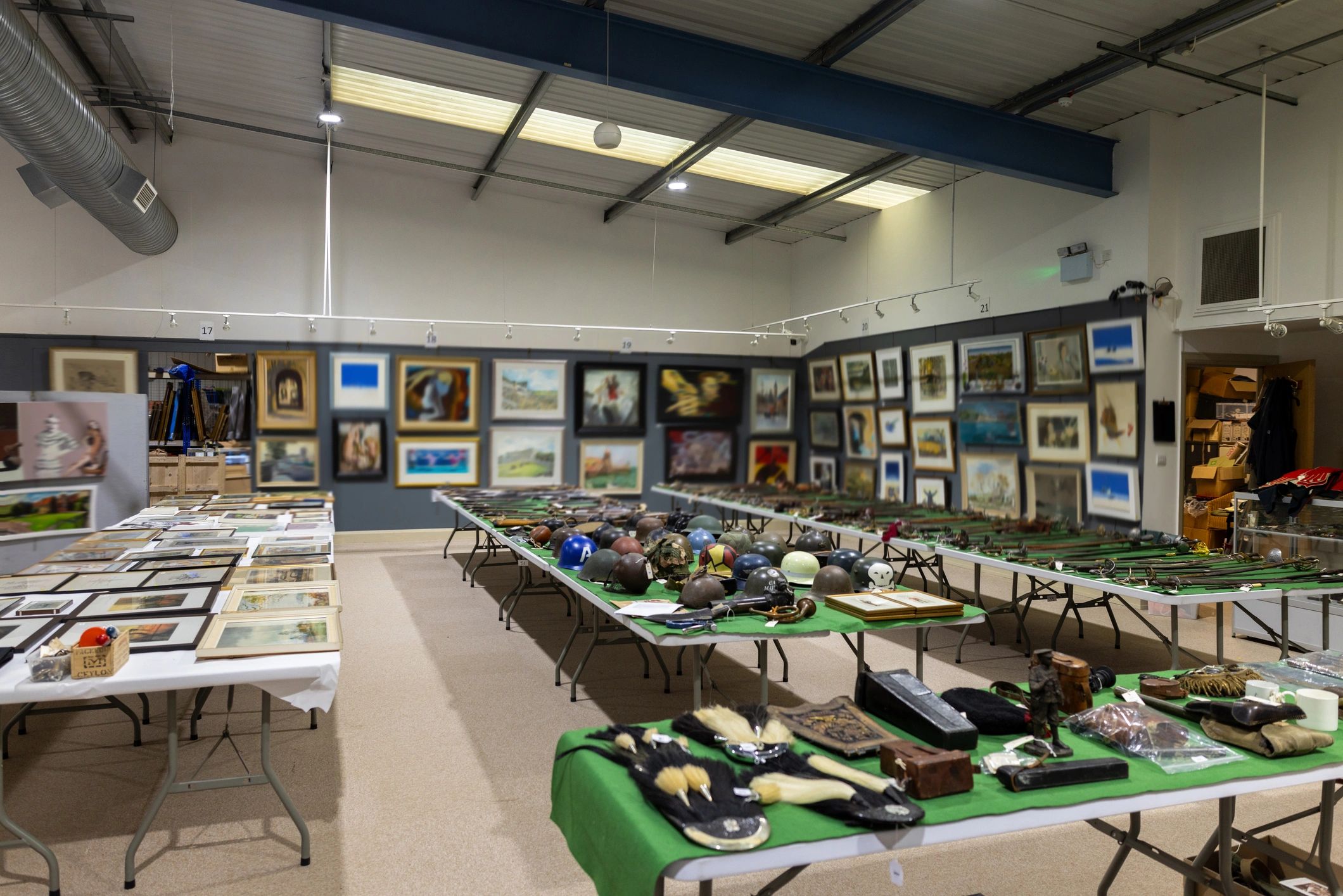 Gallery room with framed paintings on the walls